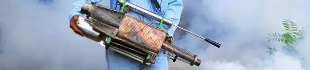 Fumigation technician using a fogger for deep pest treatment in Evansville, IN